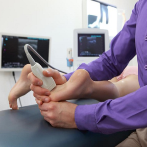 Podiatrist providing foot care treatment to a patient near Espanola, ON.